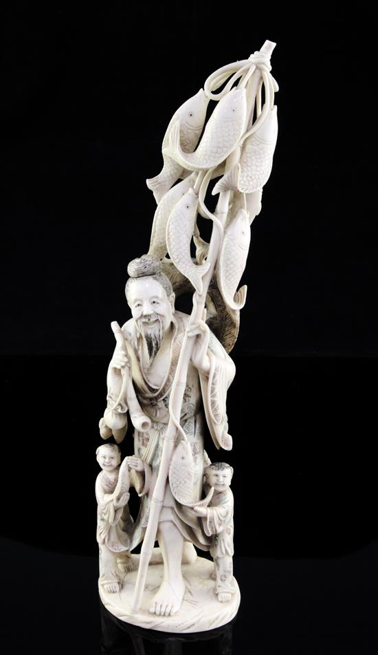 A large Chinese ivory group of a fisherman and two children, first half 20th century, 30.5cm